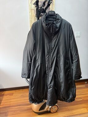 Black Puffer Coat woman with Stand Collar. Double zipper packets on each side.